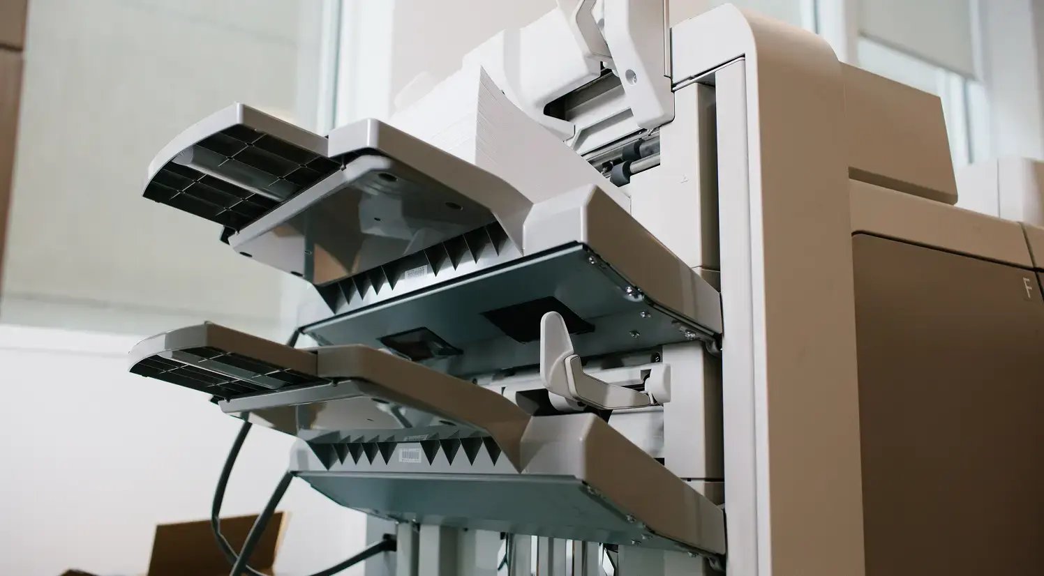 closeup of trays on side of large office printer